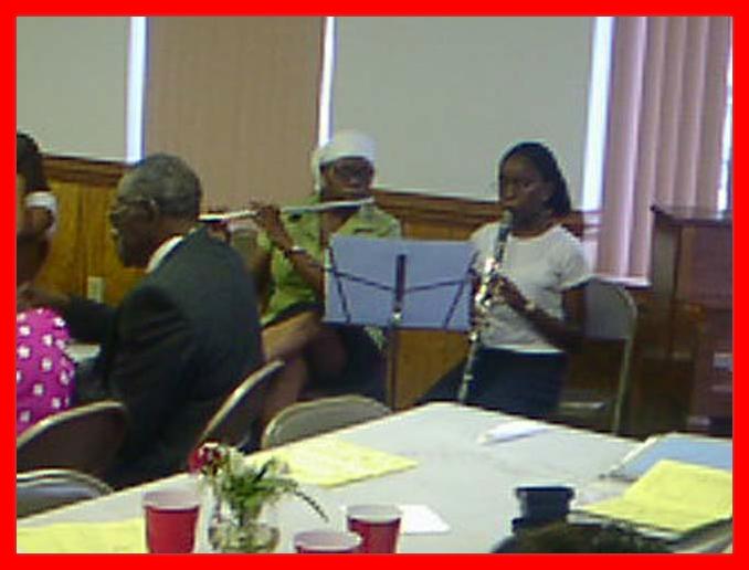 PHOTO TAKEN MAY 11, 2002

THE TWO DAUGHTERS OF MR AND MRS SYLVESTER JOHNSON
ENTERTAINS THE GROUP